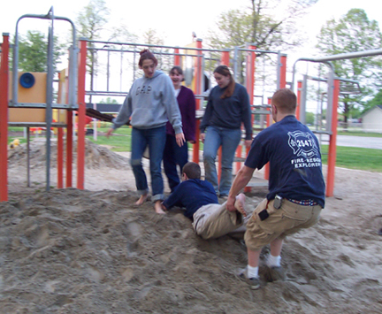 Phil is physically dragged away from a group of women in a park